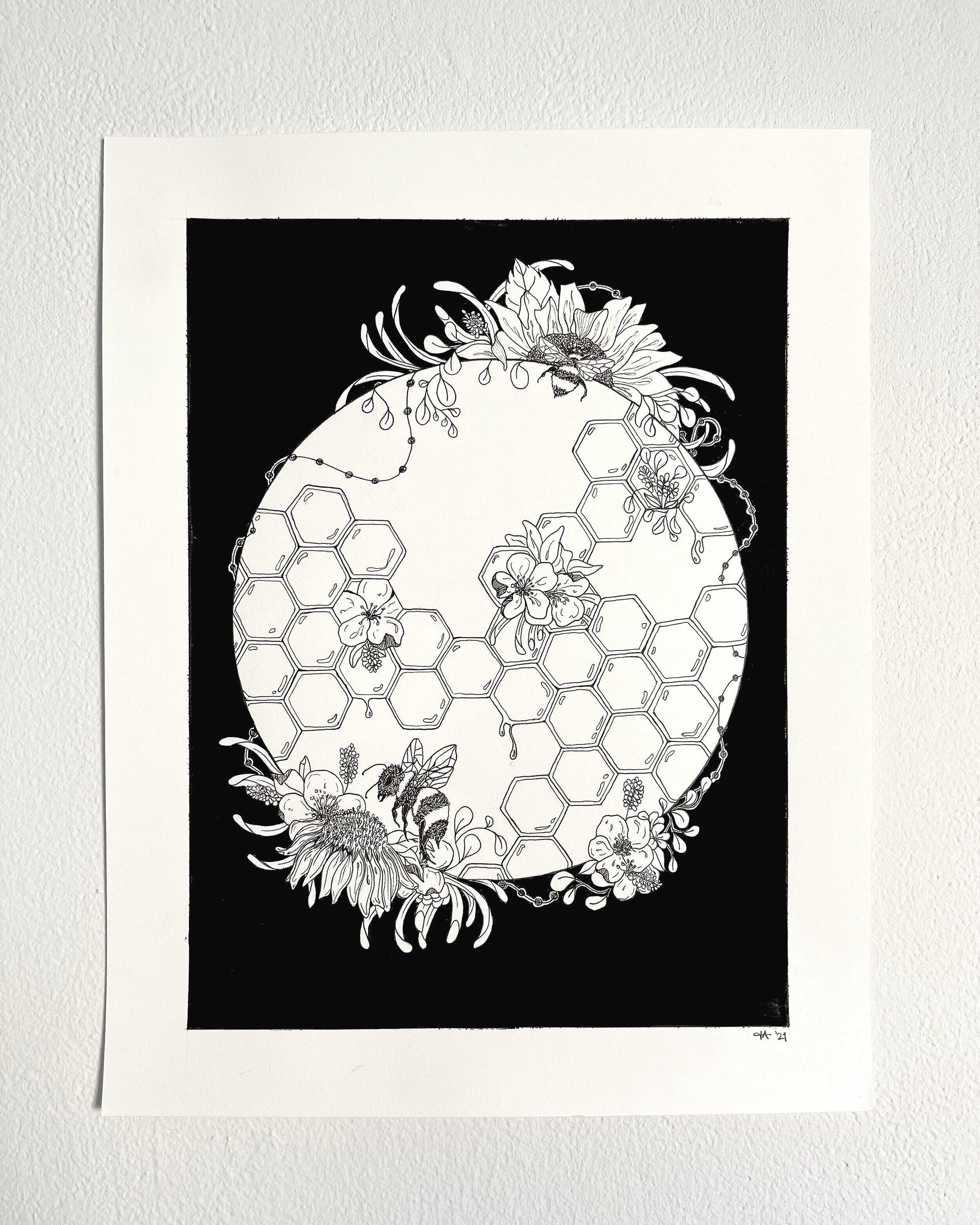 black and white illustration of honeycomb with bees and sunflowers hanging on white wall