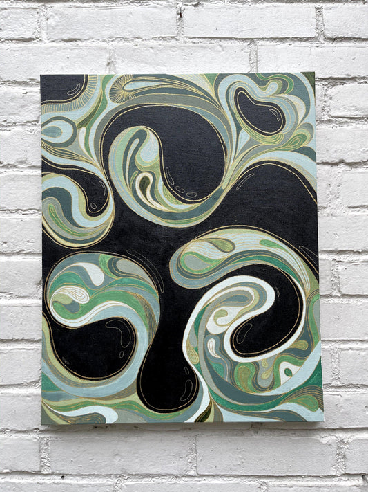 abstract painting of swirls in green tones and gold hanging on grey brick wall