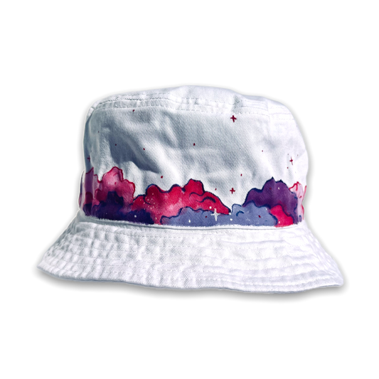 white bucket hat painted with pink and purple clouds 