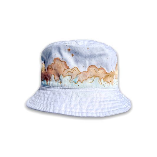Cream and light blue painted clouds on white bucket hat