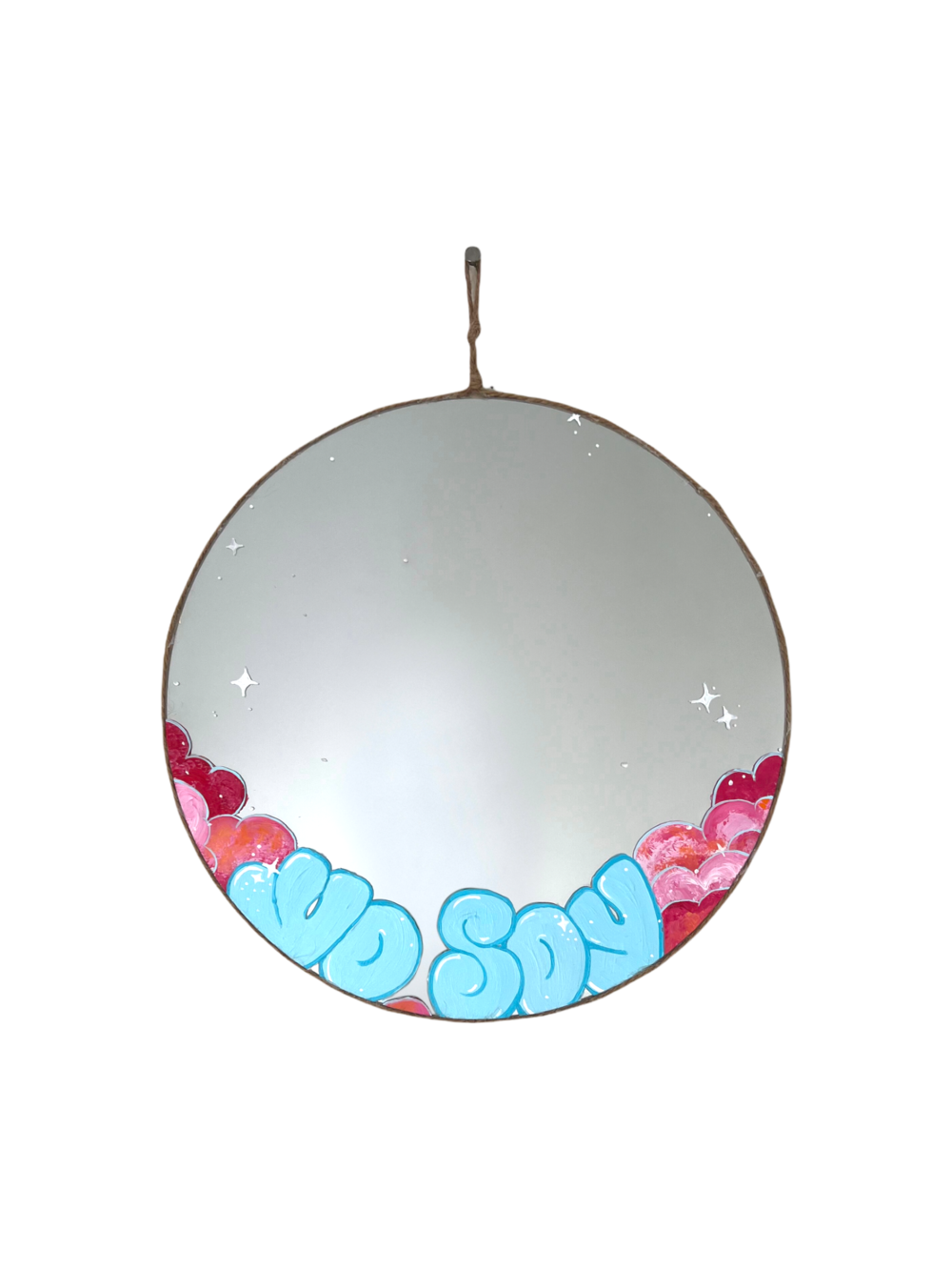 round mirror with light blue writing and pink clouds on bottom