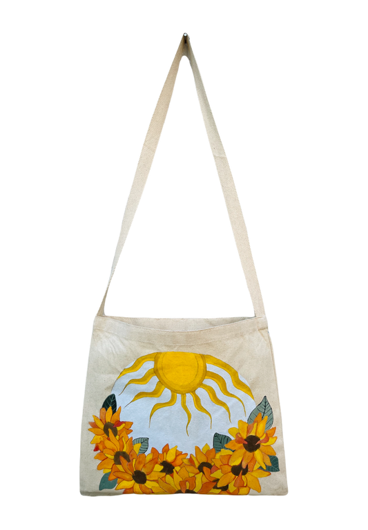 canvas tote bag with round painting of sunflowers and sun