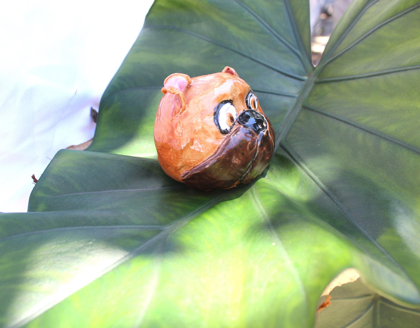 side view of ceramic brown bull dog head 