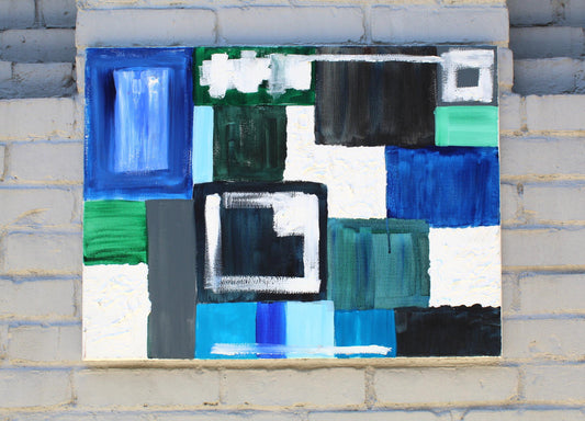 Rectangle painting of blue, white, and green pattern on grey brick wall background